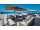 Relaxing rooftop deck with lounge seating and stunning ocean views at 1581 Gulf Blvd # 701N, Clearwater Beach, FL 33767