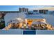 Luxury rooftop deck features an outdoor kitchen, lounge seating, and dining area at 1581 Gulf Blvd # 701N, Clearwater Beach, FL 33767