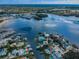 Panoramic aerial view of waterfront homes and marinas, highlighting the community's desirable location and amenities at 160 Shore Dr, Palm Harbor, FL 34683