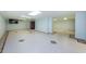 A spacious and bright basement featuring modern tile flooring, perfect for entertaining or creating a Gathering area at 160 Shore Dr, Palm Harbor, FL 34683