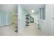 A spacious basement with tile flooring and shelving offers great potential for storage or additional living space at 160 Shore Dr, Palm Harbor, FL 34683