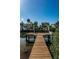 A private wooden dock leading to waterfront, perfect for boating and enjoying serene water views at 160 Shore Dr, Palm Harbor, FL 34683