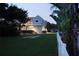 Charming two-story home with a well-manicured lawn and inviting outdoor space at 160 Shore Dr, Palm Harbor, FL 34683