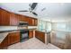 Stylish kitchen with granite countertops, stainless appliances, tile floor, and custom wood cabinetry at 160 Shore Dr, Palm Harbor, FL 34683