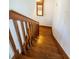 Wooden staircase with classic railing leading to upper or lower levels at 160 Shore Dr, Palm Harbor, FL 34683