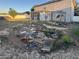 Backyard of home featuring screened in patio, small deck, and overgrown foliage at 16027 Vine Cliff Ave, Hudson, FL 34667