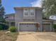 Charming two-story home with attached two-car garage and neutral toned stucco exterior at 16027 Vine Cliff Ave, Hudson, FL 34667