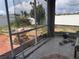 View of a screened in porch needing repair and clean-up, offering a glimpse of the outdoor space at 16027 Vine Cliff Ave, Hudson, FL 34667