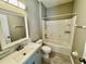 Updated bathroom featuring a tub with shower, modern vanity, and stylish tile accents at 1878 Greenwood Valley Dr, Plant City, FL 33563