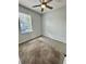 Bedroom with neutral paint, carpet flooring, and window at 1878 Greenwood Valley Dr, Plant City, FL 33563