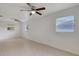 Bright bedroom with tile flooring, ceiling fans, and windows at 1903 24Th St, Sarasota, FL 34234