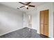 Bedroom with tiled floor, ceiling fan, closet, and open door frame at 1903 24Th St, Sarasota, FL 34234