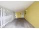 Covered carport area with a concrete floor and access to the home's entrance at 1903 24Th St, Sarasota, FL 34234