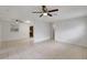Bright, open living room with tile flooring, ceiling fans, and neutral color scheme at 1903 24Th St, Sarasota, FL 34234