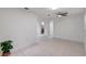 Clean, bright living area with tile flooring and a view into other rooms at 1903 24Th St, Sarasota, FL 34234