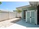 Private backyard featuring white fencing, a storage shed, and brick pavers at 1960 Canadiana Ct, Dunedin, FL 34698