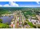 Aerial view showcases the home's location in a tree-lined neighborhood, with its mature landscaping and proximity to local amenities at 2119 Sugarbush Dr, Holiday, FL 34690