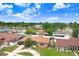 Spacious property in a quiet neighborhood showcasing mature trees and well-maintained landscaping at 2119 Sugarbush Dr, Holiday, FL 34690