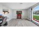 Neutral living room with updated flooring, providing a bright and comfortable space at 2119 Sugarbush Dr, Holiday, FL 34690