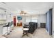 Open living space adjacent to breakfast bar, with plush seating and stylish decor at 2119 Sugarbush Dr, Holiday, FL 34690