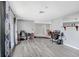 Spacious open-plan living room with updated floors, perfect for entertaining guests at 2119 Sugarbush Dr, Holiday, FL 34690