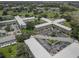 Aerial view of a community of buildings and green spaces on a sunny day at 2466 Ecuadorian Way # 32, Clearwater, FL 33763