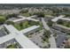 Aerial view featuring well-maintained condominium complex with green spaces, parking, and a serene neighborhood setting at 2466 Ecuadorian Way # 32, Clearwater, FL 33763