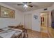 Comfortable bedroom featuring wood-look floors, a closet, and a doorway leading to an adjacent area at 2466 Ecuadorian Way # 32, Clearwater, FL 33763