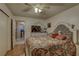 Bedroom featuring parquet floors and a closet at 2466 Ecuadorian Way # 32, Clearwater, FL 33763