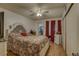 Comfortable bedroom with a ceiling fan, closet, and ensuite bathroom at 2466 Ecuadorian Way # 32, Clearwater, FL 33763