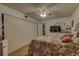 Bedroom featuring parquet floors, a ceiling fan, and a closet at 2466 Ecuadorian Way # 32, Clearwater, FL 33763