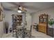 Cozy dining room with tile floors, ceiling fan, and classic china cabinet at 2466 Ecuadorian Way # 32, Clearwater, FL 33763