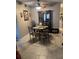 The dining area features tile flooring, decorative ceiling fan and table that sits six people comfortably at 2466 Ecuadorian Way # 32, Clearwater, FL 33763