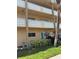 Inviting exterior of a multi-story condo building featuring well-maintained landscaping and secure private balconies at 2466 Ecuadorian Way # 32, Clearwater, FL 33763