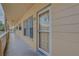 View of condo front door with windows, located on a shared outdoor hall at 2466 Ecuadorian Way # 32, Clearwater, FL 33763