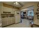 Charming kitchen with a view into another living area with natural light at 2466 Ecuadorian Way # 32, Clearwater, FL 33763