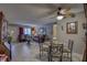 Living room and dining area with furniture, tile floor, neutral paint and front door at 2466 Ecuadorian Way # 32, Clearwater, FL 33763
