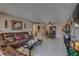 Spacious living room features tile flooring, plush seating, and access to the dining area at 2466 Ecuadorian Way # 32, Clearwater, FL 33763