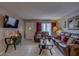 Comfortable living room with neutral paint, tile floors and leather furniture at 2466 Ecuadorian Way # 32, Clearwater, FL 33763