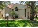 Beautifully landscaped home exterior showcasing a well-manicured lawn and mature trees at 247 Los Prados Dr # 1123, Safety Harbor, FL 34695