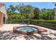 Relaxing community hot tub area with a tiled deck and tranquil surroundings at 247 Los Prados Dr # 1123, Safety Harbor, FL 34695