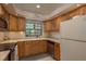 Bright kitchen featuring wood cabinets, stainless steel appliances and light countertops at 247 Los Prados Dr # 1123, Safety Harbor, FL 34695