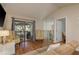 Bright living room with hardwood floors, comfortable seating and a view of the private balcony at 247 Los Prados Dr # 1123, Safety Harbor, FL 34695