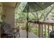 Charming patio featuring an umbrella, comfortable seating, and a view of the well-maintained landscaping at 247 Los Prados Dr # 1123, Safety Harbor, FL 34695