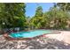 Beautiful community pool featuring a spacious deck and inviting blue water at 247 Los Prados Dr # 1123, Safety Harbor, FL 34695