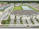 A beautiful aerial view of these townhomes near a body of water within a well-manicured community at 26082 Woven Wicker Bnd, Lutz, FL 33559