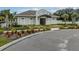 Charming community clubhouse surrounded by vibrant landscaping and convenient parking at 26082 Woven Wicker Bnd, Lutz, FL 33559