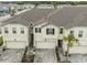 This is a slightly elevated view of the exterior of these townhomes and attached garages at 26082 Woven Wicker Bnd, Lutz, FL 33559