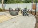 Community fire pit surrounded by Adirondack chairs and lush landscaping at 26082 Woven Wicker Bnd, Lutz, FL 33559