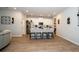 This kitchen offers an open floor plan with an island bar, stainless appliances and white cabinets at 26082 Woven Wicker Bnd, Lutz, FL 33559